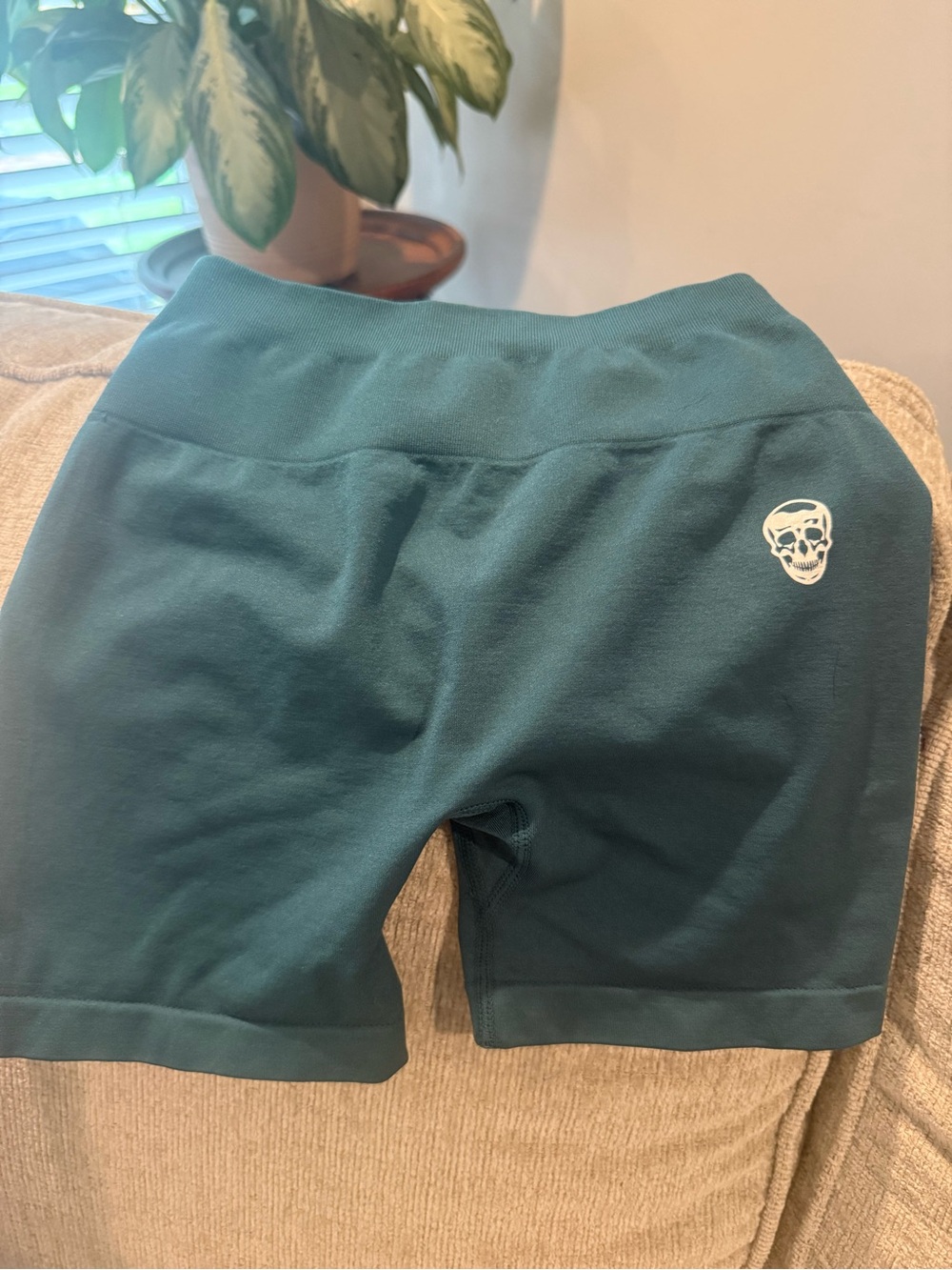Gymshark Teal Green Athletic Shorts with White Skull Logo